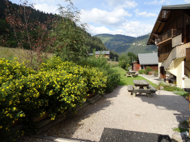 Chalet Le Petit Cornillon, Terrace with table, Châtel in summer